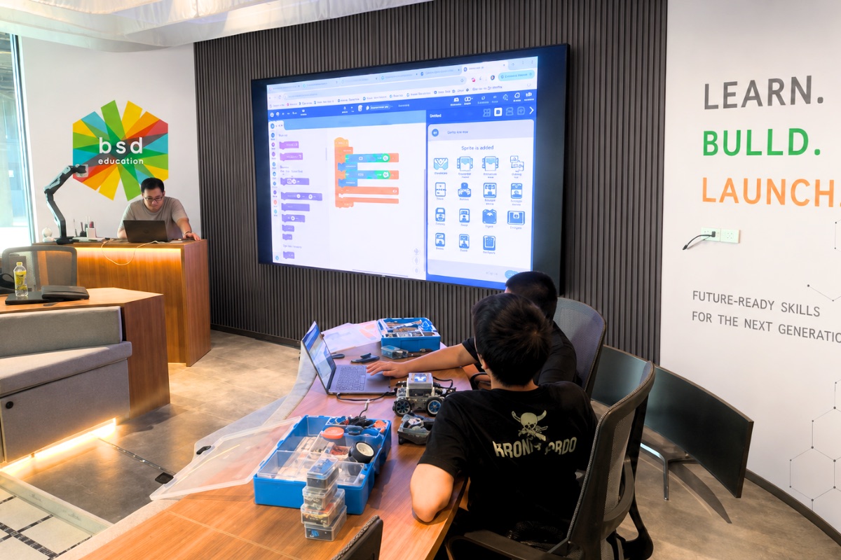 Young students building robotics and coding projects in the Discovery Lab